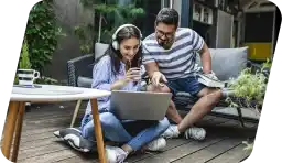A family using their internet connected devices outside