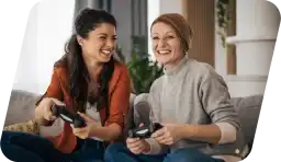 Two friends playing console games