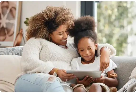 A mother and daughter using a tablet