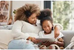 A mother and daughter using a tablet