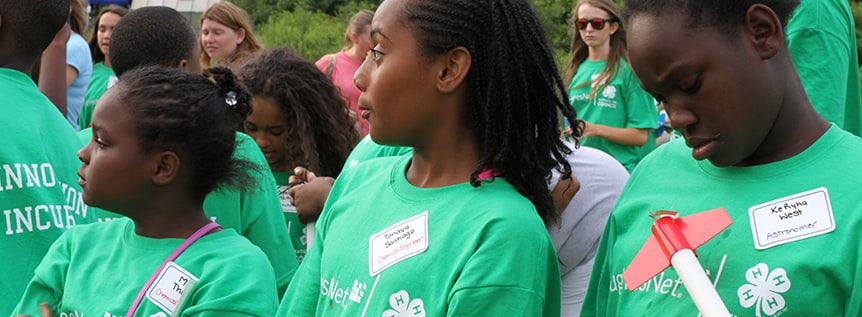 4-H students with model rockets in hand