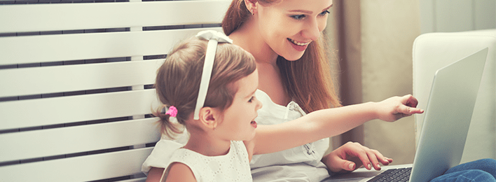 Image of mother and daughter on laptop