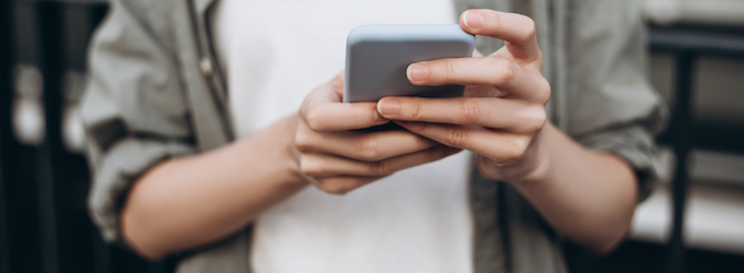close up of person holding iphone