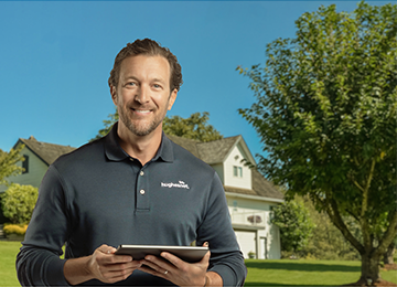 Hughesnet installer outside of rural home