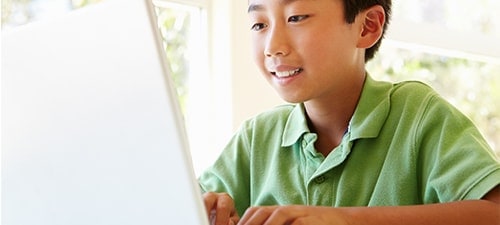 Kid Image of kid learning at fast speeds with HughesNet Gen5