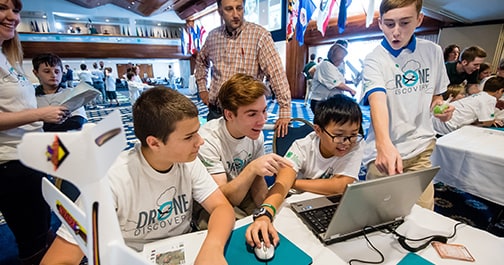 Image of students at National Youth Science benefiting from the partnership between 4-H and HughesNet