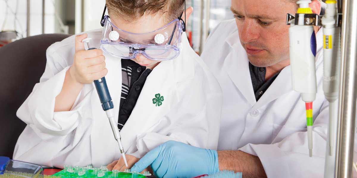 Image of 4-H student and scientist working together