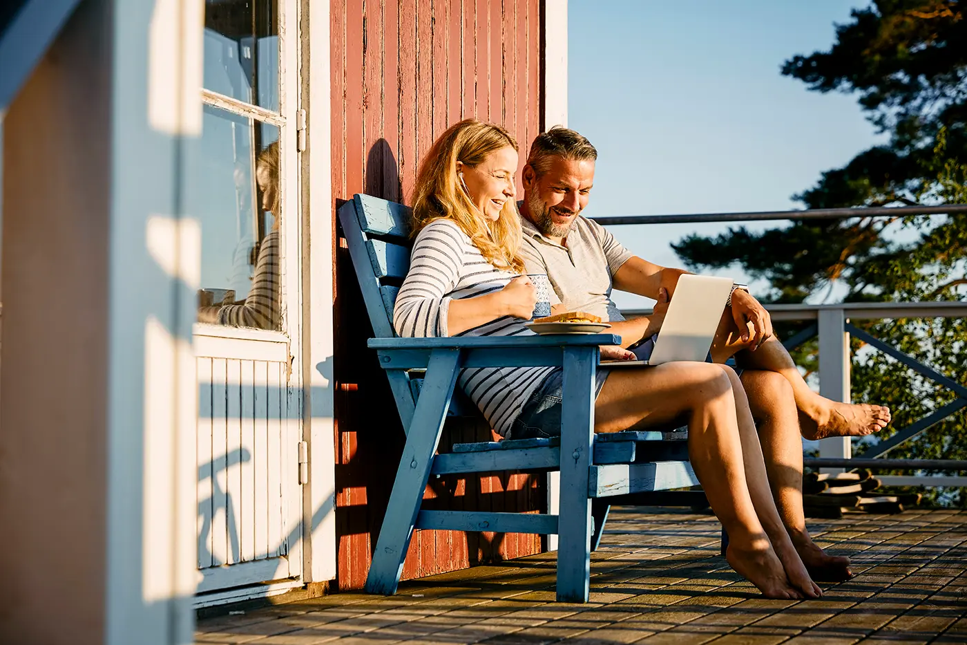 couple on porch using satellite internet