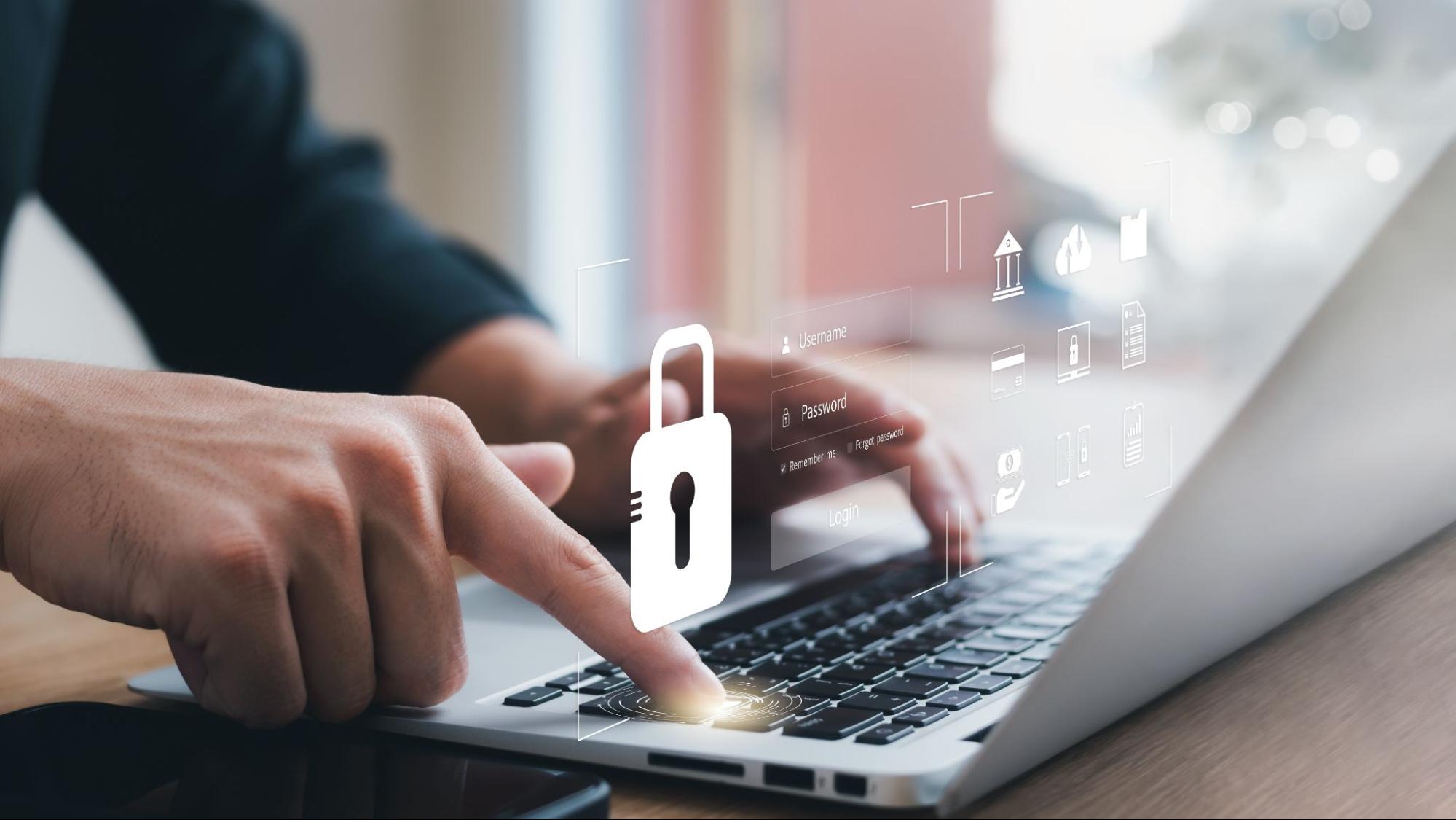 A person typing on a laptop