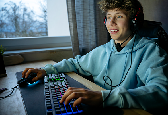 Kid playing video games on Hughesnet Fusion