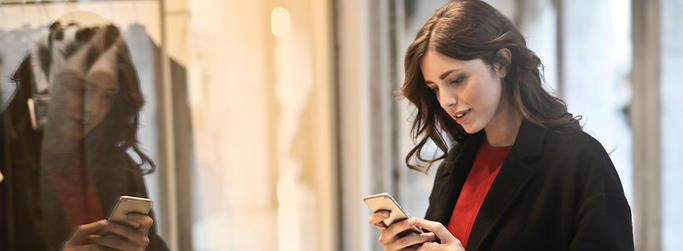 woman shopping looking at her phone