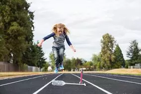 student outside on a track