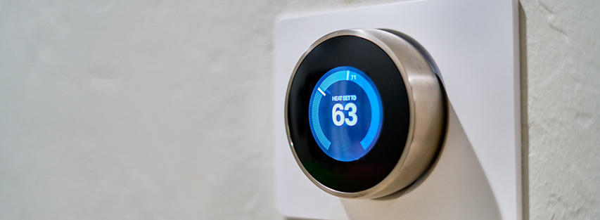 Smart thermostat displaying the temperature, demonstrating an example of the Internet of Things in action.