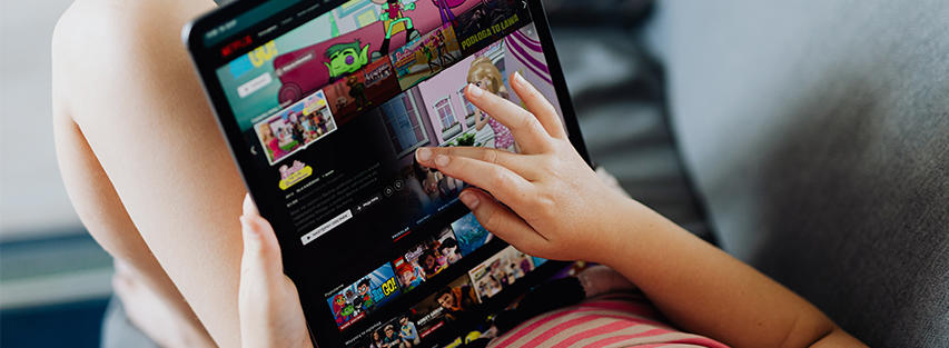 child browsing on ipad