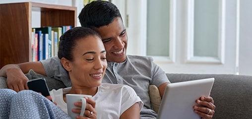 Couple streaming video on couch