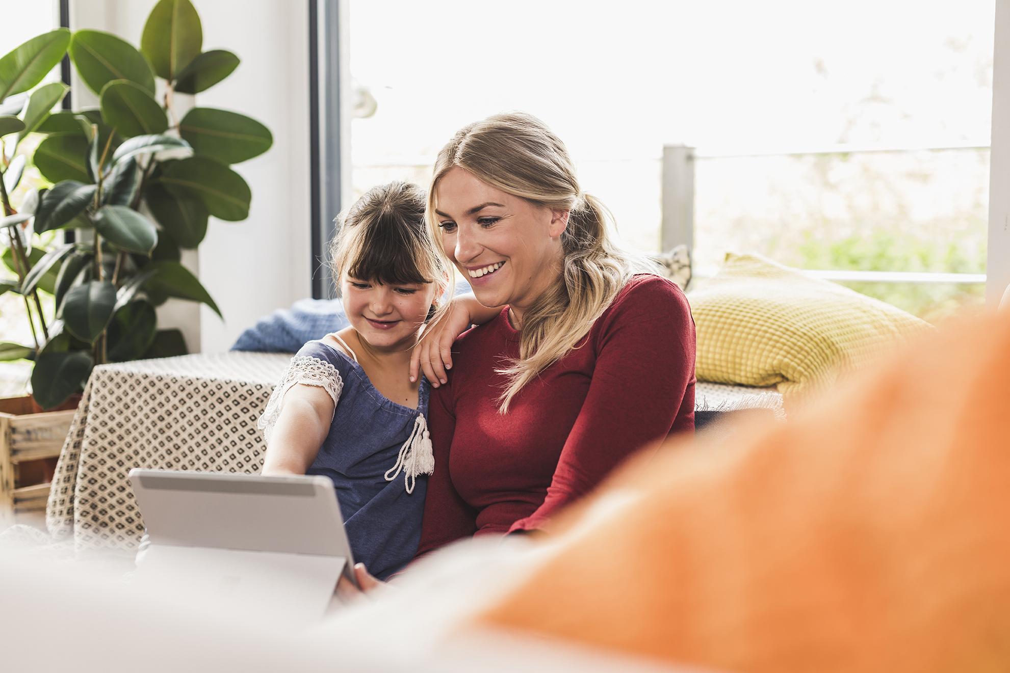 woman and child using laptop with fast satellite internet
