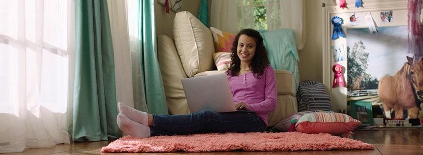 Girl with her computer on her lap