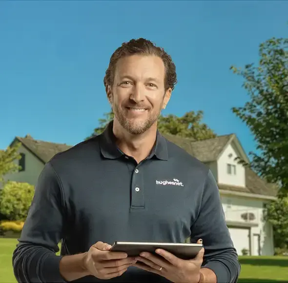 Hughesnet installer outside of rural home in America