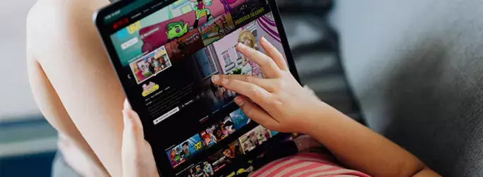 child browsing on ipad