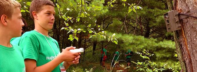 4-H representatives next to a tree