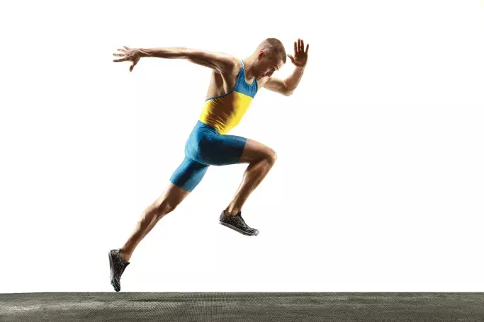 Sprinter mid-stride, representing the speed and performance of Hughesnet rural internet connectivity.