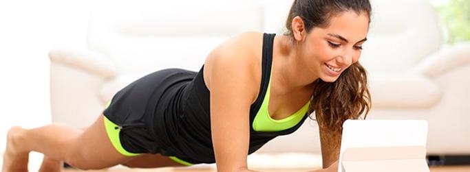 Image of woman using HughesNet satellite Internet to exercise