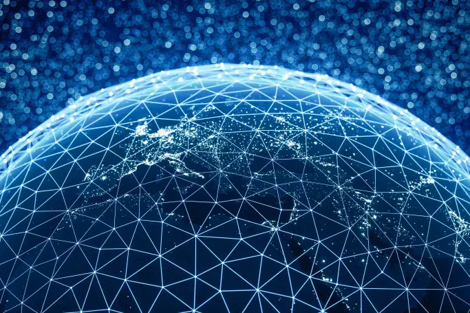 Digital globe with a glowing network, illustrating the reach of satellite internet.