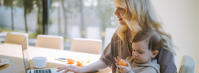 Mother and baby at computer