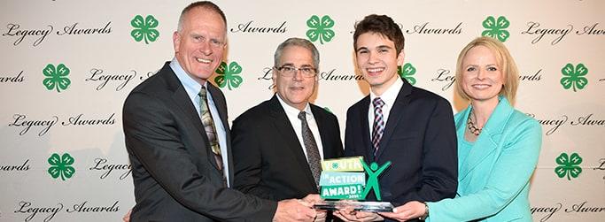 Thad Hughes with representatives from 4-H and Hughes