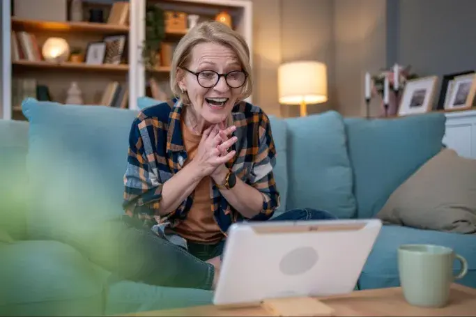 A senior woman looking at her laptop